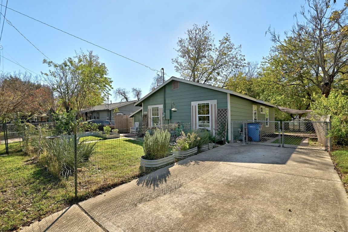 4615 Munson Street Austin, TX 78721 - Photo 23 of 27 View of front of home featuring a gate, a patio area, and concrete driveway
