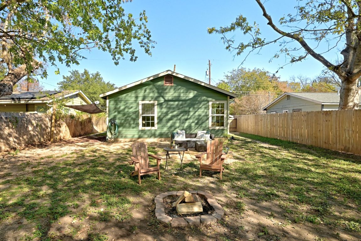 4615 Munson Street Austin, TX 78721 - Photo 27 of 27 Back of house with a fire pit and a fenced backyard