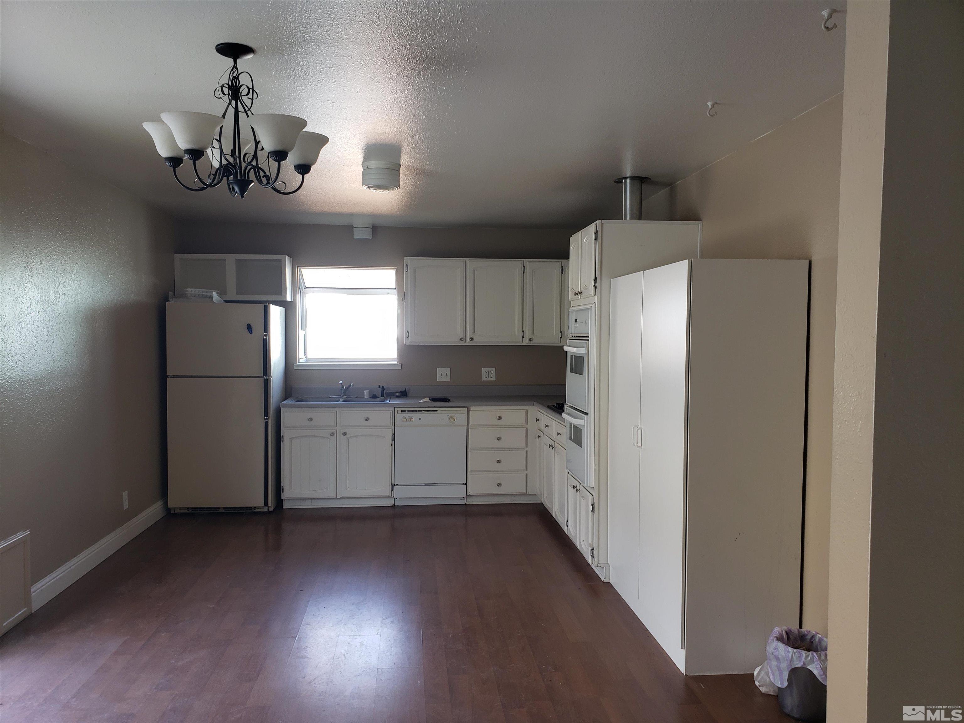 1545 Peavine Road Reno, NV 89503 - Photo 4 of 11 a kitchen with refrigerator and window