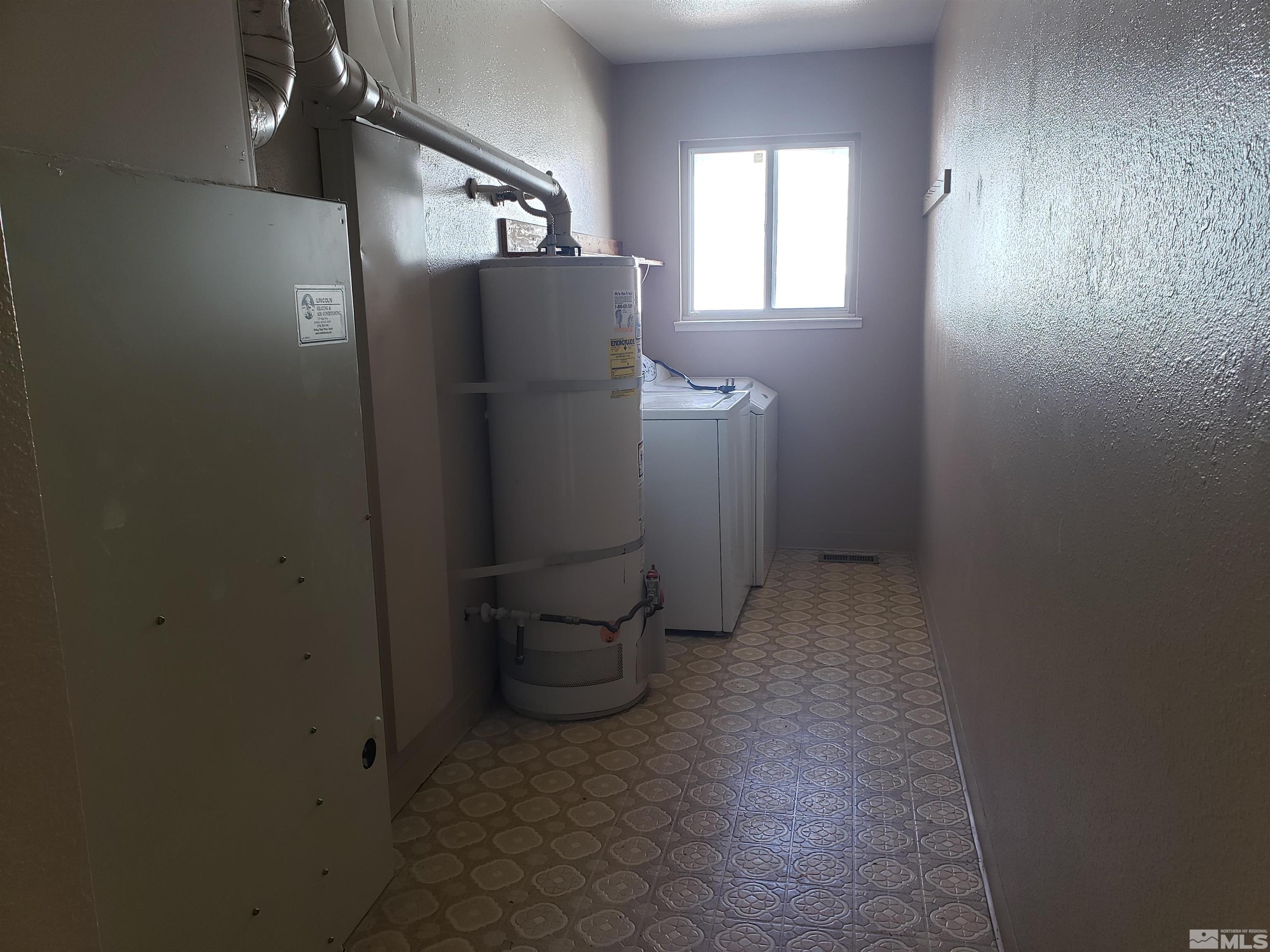 1545 Peavine Road Reno, NV 89503 - Photo 5 of 11 a view of a storage & utility room with washer and dryer