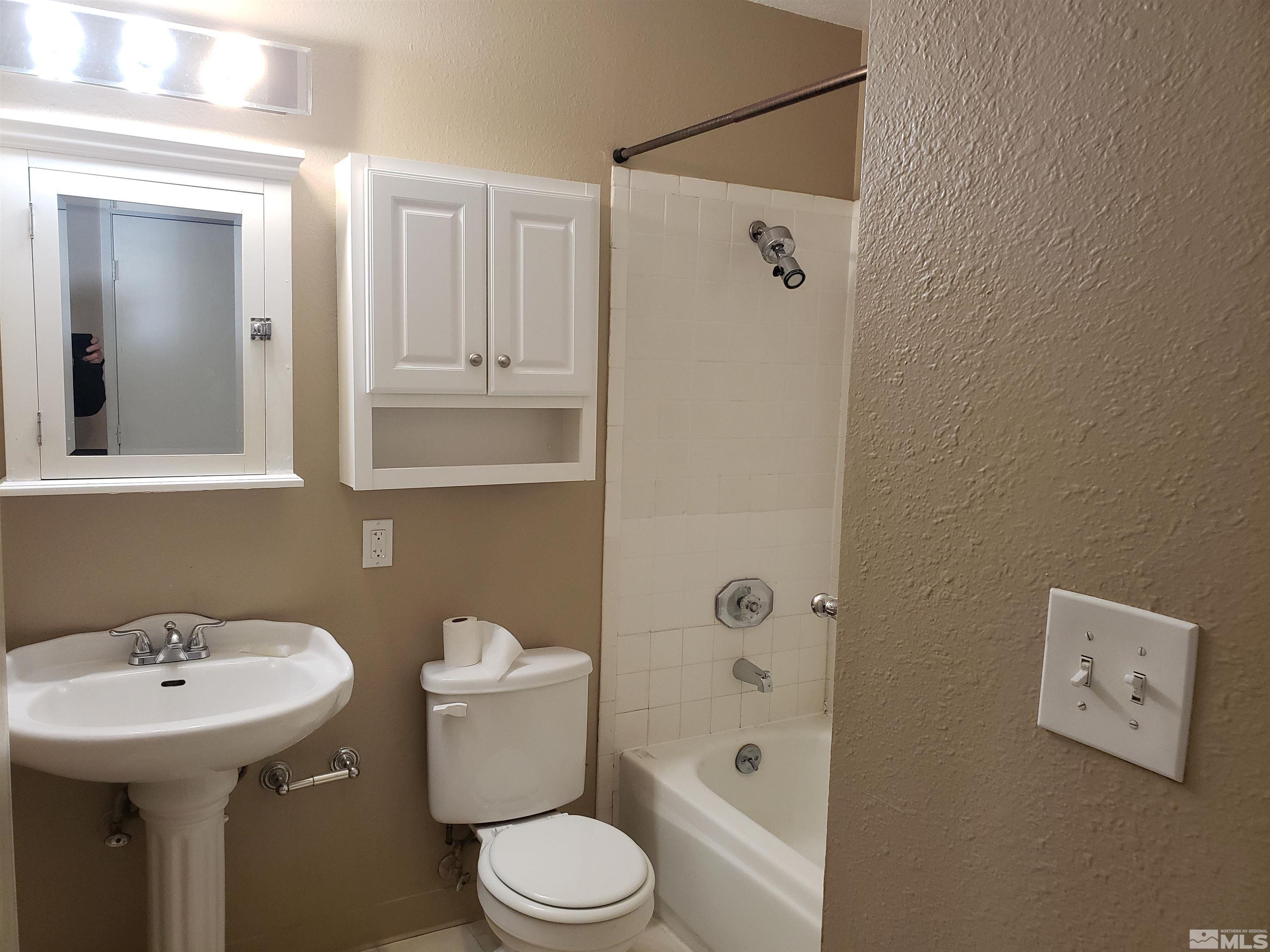 1545 Peavine Road Reno, NV 89503 - Photo 6 of 11 a bathroom with a sink a toilet and shower