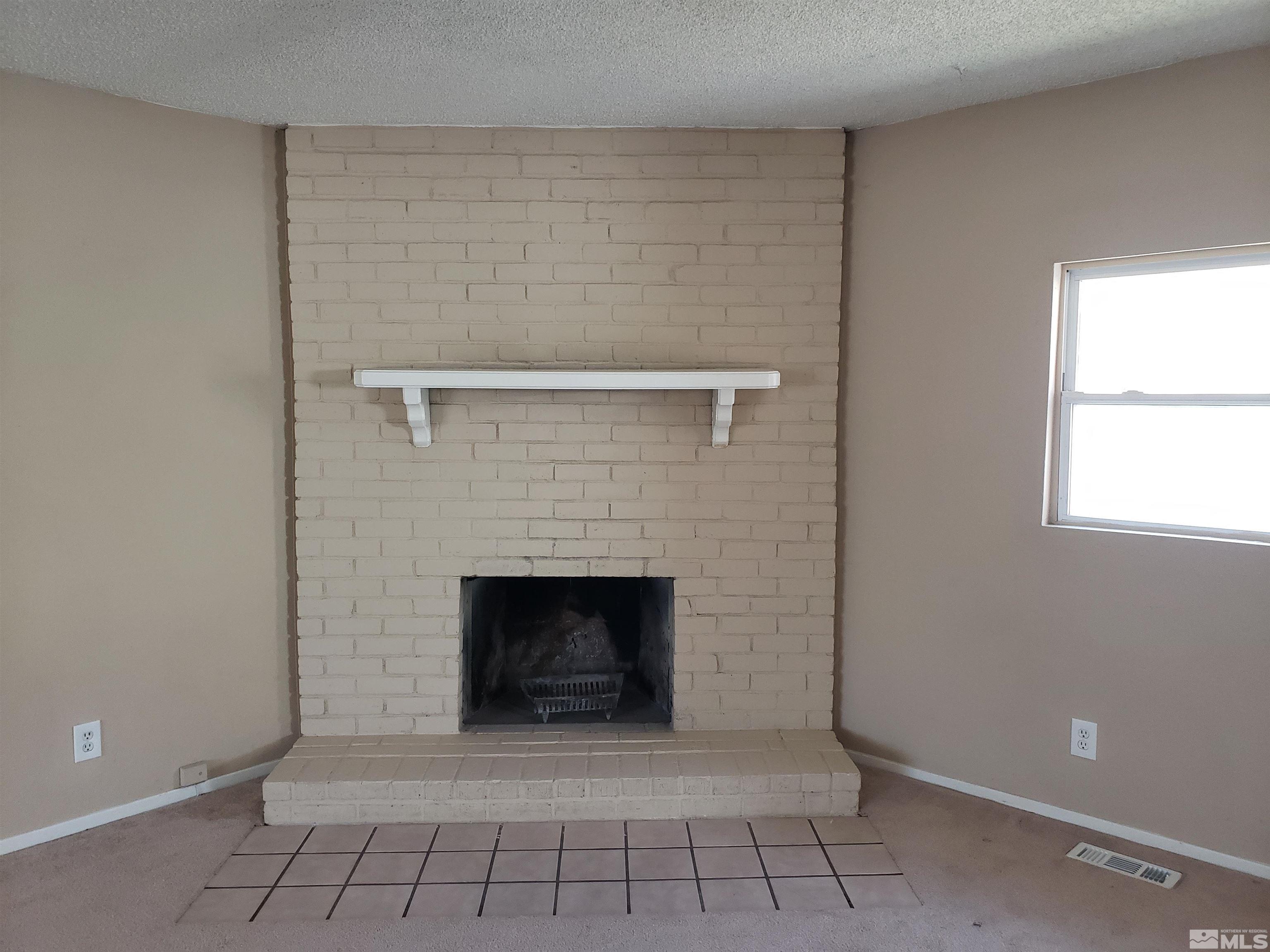 1545 Peavine Road Reno, NV 89503 - Photo 9 of 11 a room with a fireplace