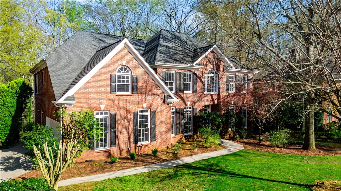 204 Red Maple Way Clemson, SC 29631 - Photo 2 of 48 This brick residence features charming dormers and a spacious lawn, nestled among mature trees.