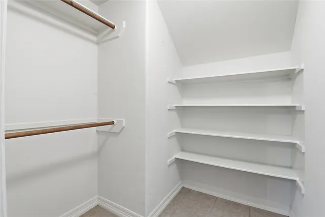 a view of an empty walk in closet
