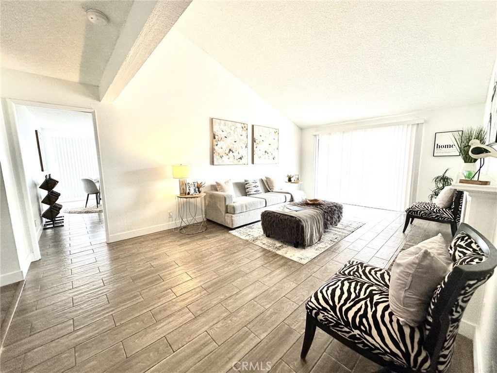 1161 Blue Ridge Lane Colton, CA 92324 - Photo 15 of 36 a living room with furniture and a wooden floor