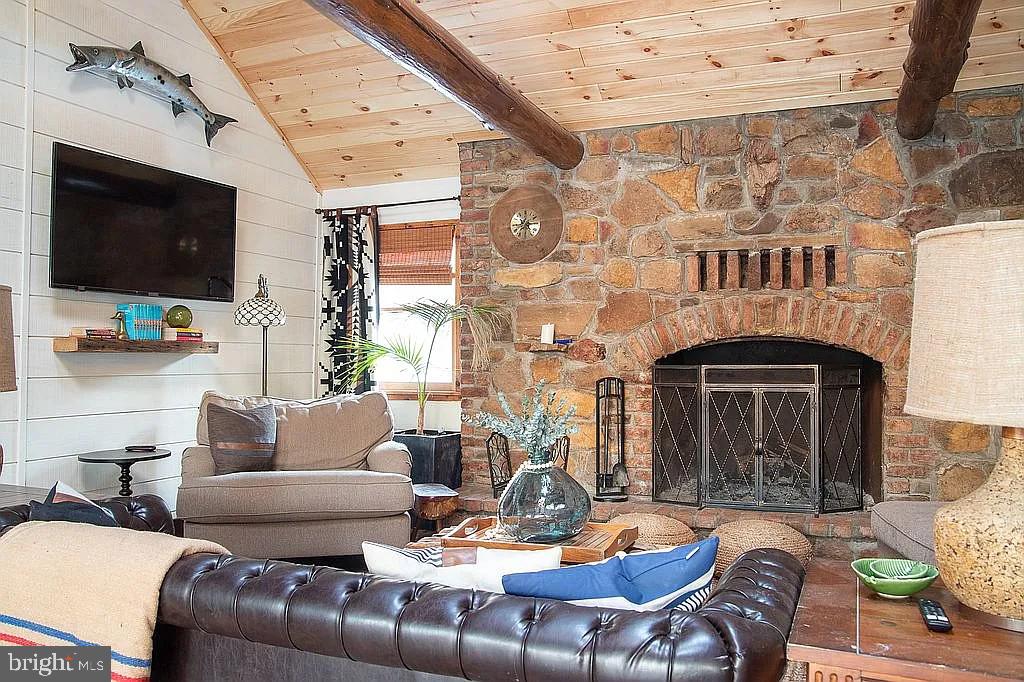 590 Hunters Camp Road Great Cacapon, WV 25422 - Photo 4 of 7 Gather round the fireplace