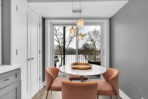 a view of a dining room with furniture window and outside view