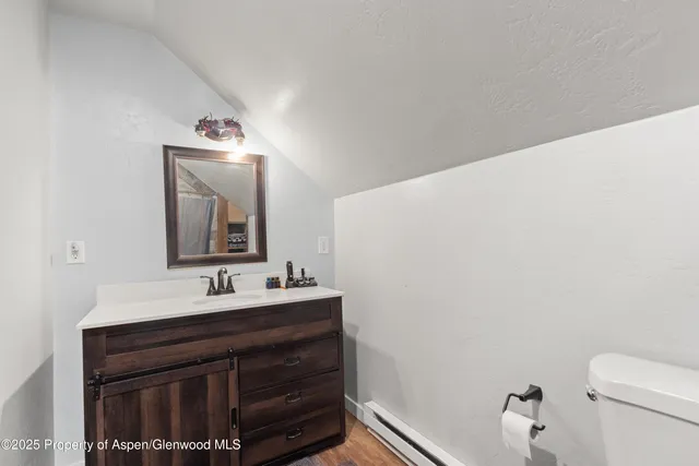 a bathroom with a sink vanity and a mirror