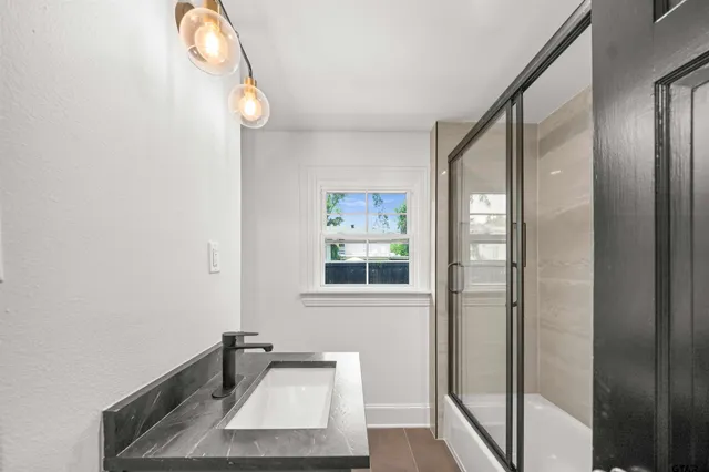 a bathroom with a sink and a mirror