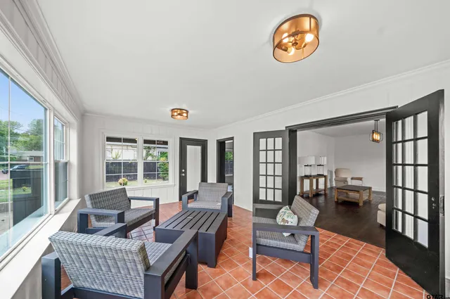 a living room with furniture a wooden floor and a table