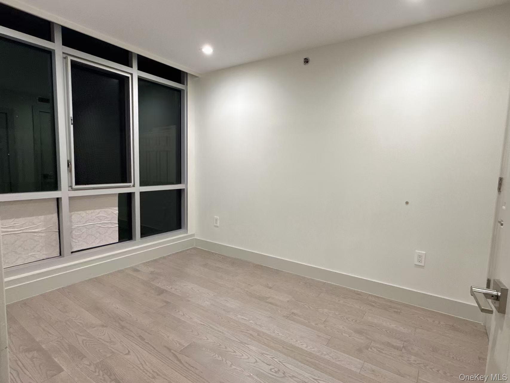 41-62 Bowne Street, Unit 3E Queens, NY 11355 - Photo 6 of 9 a view of an empty room