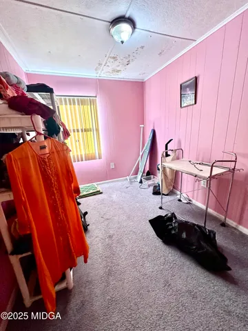 a bedroom with bed and window