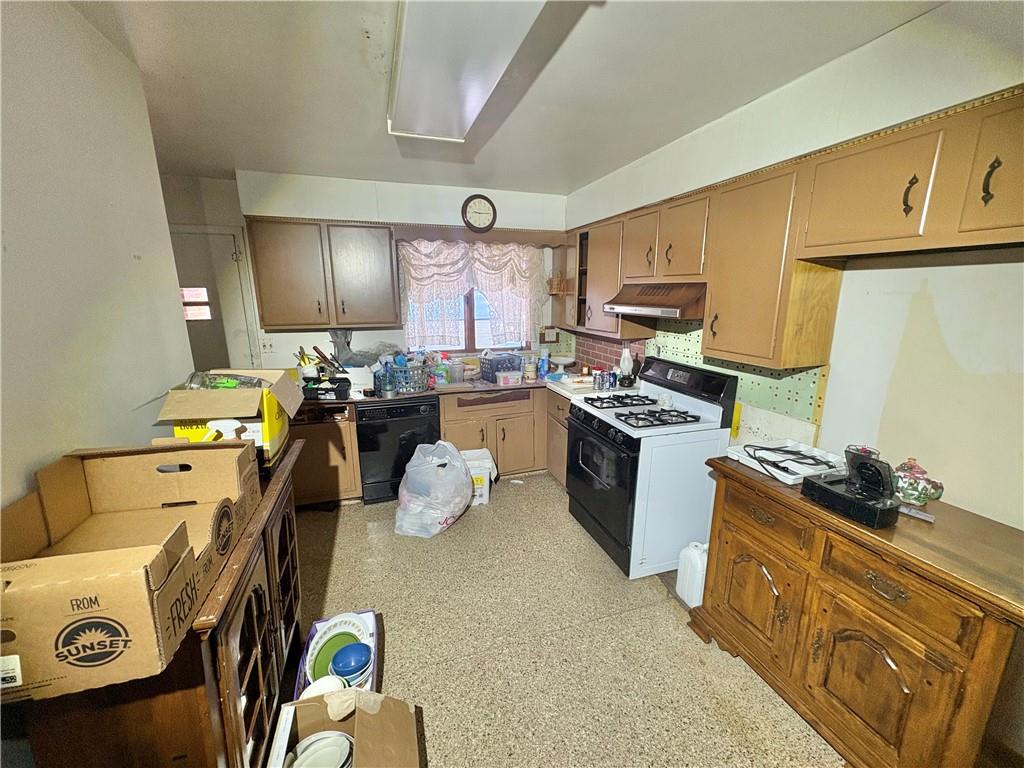 4134 South R 1022 New Brighton, PA 15066 - Photo 15 of 27 a kitchen that has a sink and a stove