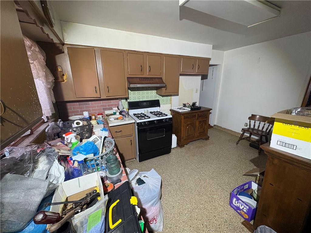 4134 South R 1022 New Brighton, PA 15066 - Photo 17 of 27 a view of a kitchen with fridge and workspace