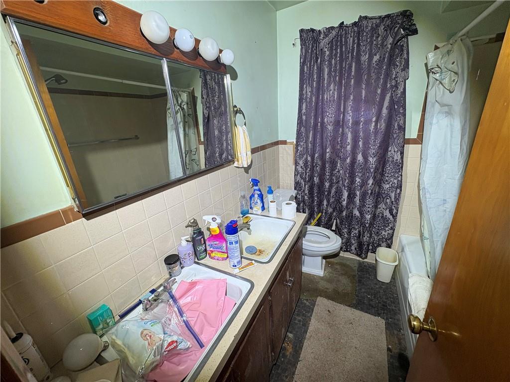 4134 South R 1022 New Brighton, PA 15066 - Photo 20 of 27 a bathroom with a sink mirror and vanity