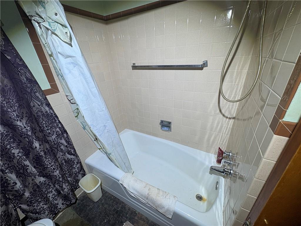 4134 South R 1022 New Brighton, PA 15066 - Photo 21 of 27 a bathroom with a bathtub and a shower