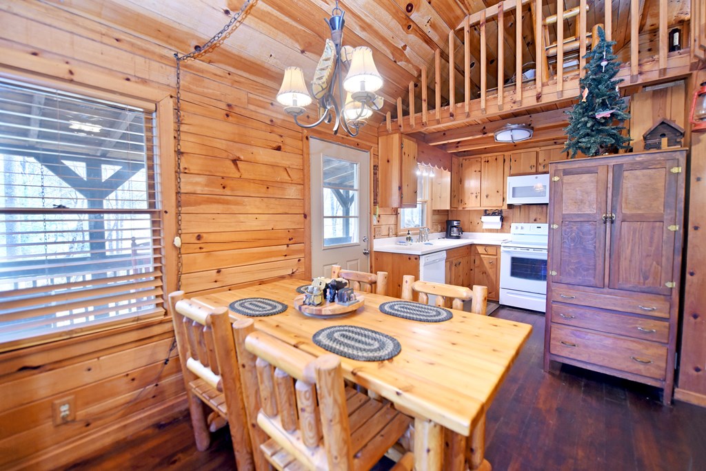 545 Laurel Circle Blue Ridge, GA 30513 - Photo 29 of 54 a view of a patio with table and chairs