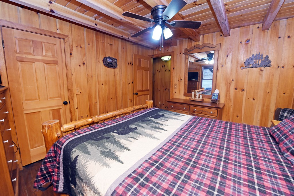 545 Laurel Circle Blue Ridge, GA 30513 - Photo 37 of 54 a bedroom with a bed and a mirror