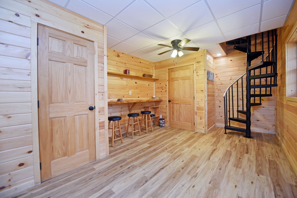 545 Laurel Circle Blue Ridge, GA 30513 - Photo 47 of 54 a view of a hallway with wooden floor and staircase