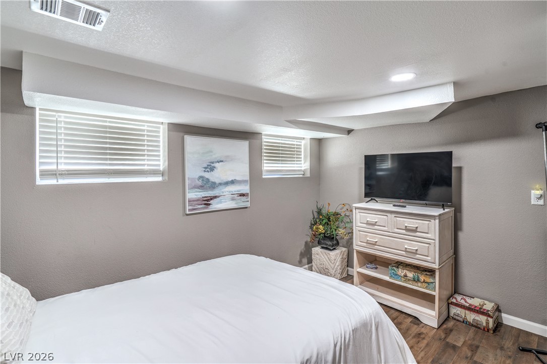 623 California Avenue Boulder City, NV 89005 - Photo 22 of 38 Two Downstairs Secondary Bedrooms with Laminate Wood Flooring
