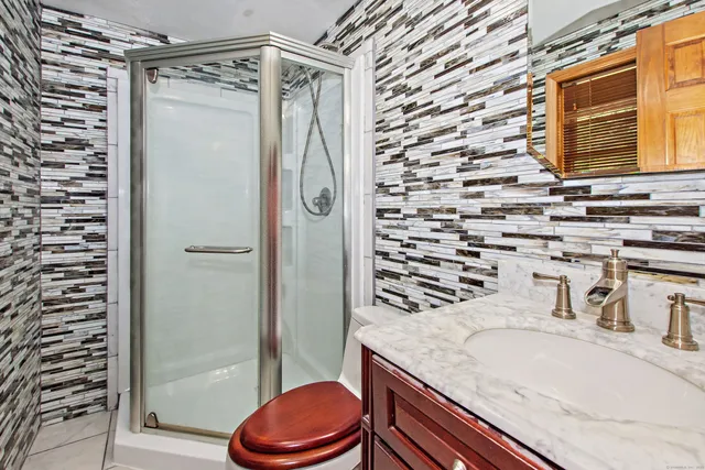 a bedroom with a large bed and a large window