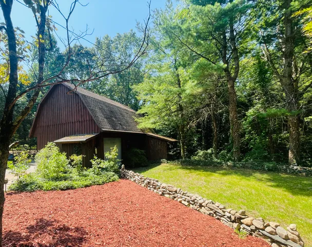 a view of a house with a yard and swimming pool