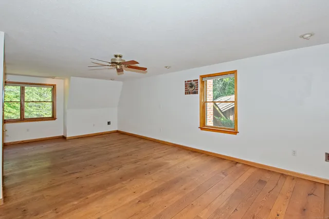 a bedroom with bed window and couch