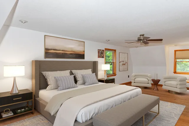 a bedroom with a bed and a window