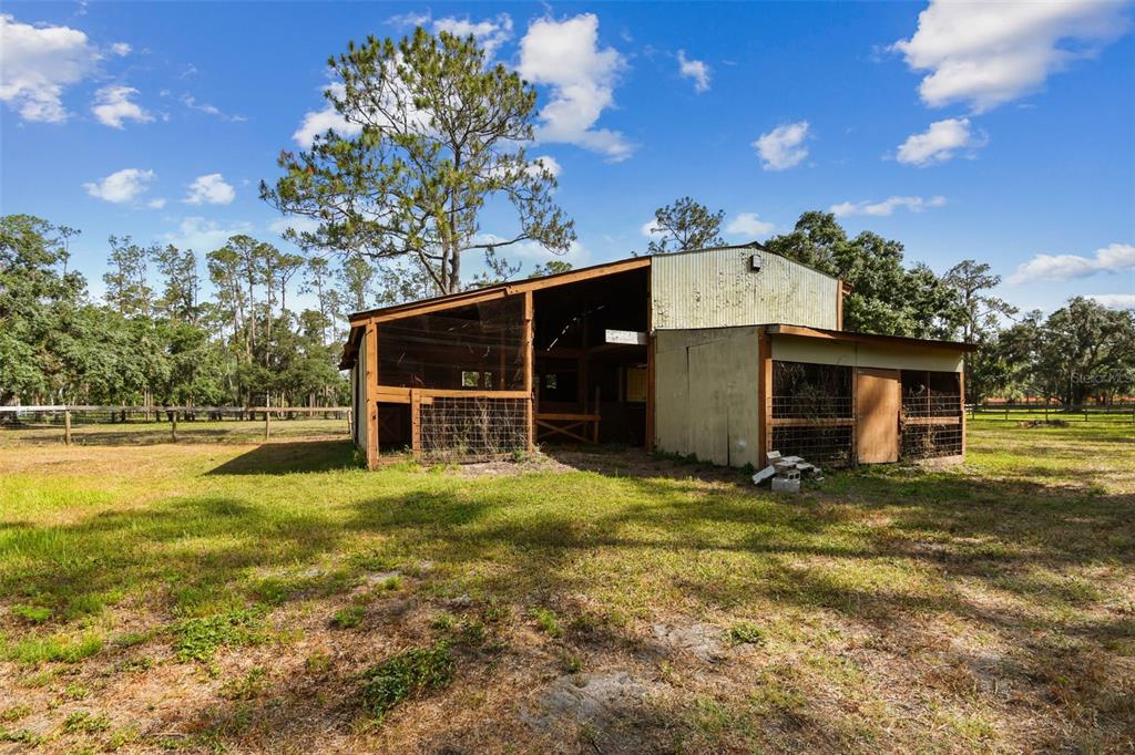 2853 Saffold Road Wimauma, FL 33598 - Photo 10 of 62 a view of a house with a yard