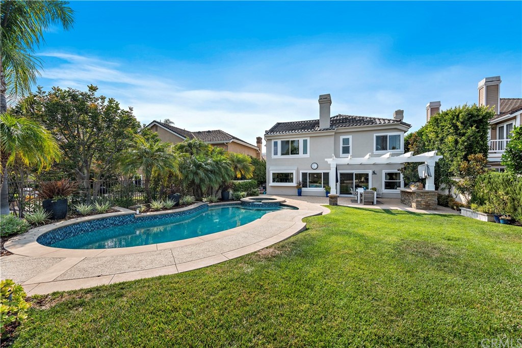 28 Bethany Laguna Niguel, CA 92677 - Photo 2 of 50 Truly an ENTERTAINER’S DREAM with pool and spa, built in BBQ, several seating areas, meticulously maintained lawn & coastal breezes