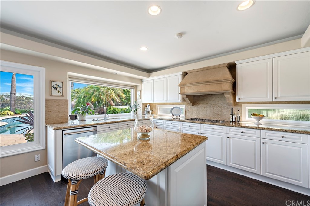 28 Bethany Laguna Niguel, CA 92677 - Photo 12 of 50 Enjoy backyard views in the gourmet kitchen with center island, stainless steel appliances, ample counter & storage space, and sunny breakfast nook.