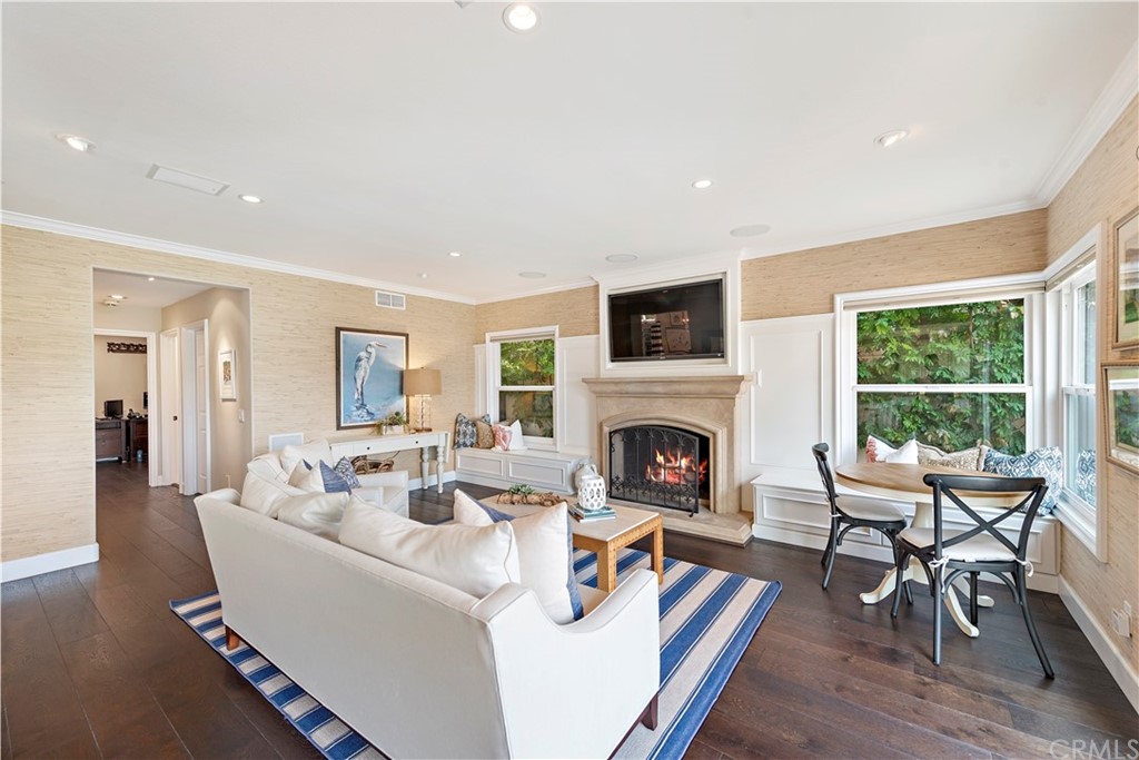 28 Bethany Laguna Niguel, CA 92677 - Photo 17 of 50 Gather or relax in the family room with cozy fireplace & sliding door entry leading to the impressive backyard.