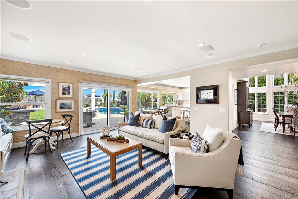 28 Bethany Laguna Niguel, CA 92677 - Photo 19 of 50 Gather or relax in the family room with cozy fireplace & sliding door entry leading to the impressive backyard.