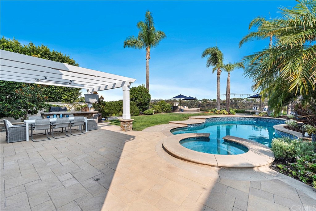 28 Bethany Laguna Niguel, CA 92677 - Photo 34 of 50 Truly an ENTERTAINER’S DREAM with pool and spa, built in BBQ, several seating areas, meticulously maintained lawn & coastal breezes