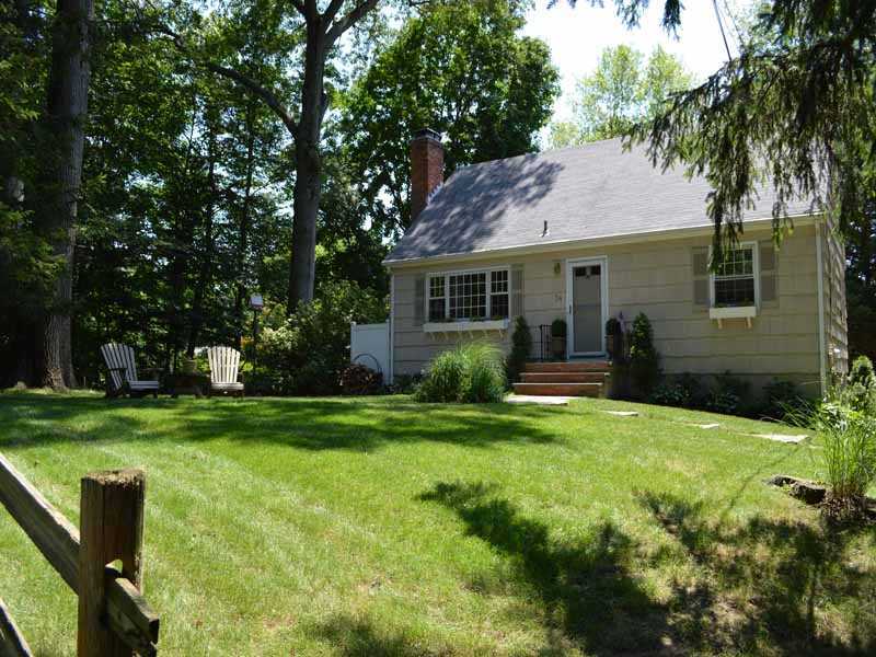 34 Meeker Court Rowayton, CT 06853 - Photo 1 of 22 a view of a house with a yard and a garden