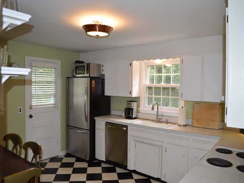 34 Meeker Court Rowayton, CT 06853 - Photo 11 of 22 a kitchen with a refrigerator and a sink