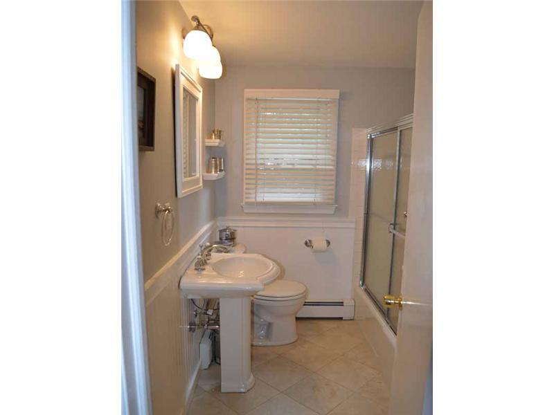 34 Meeker Court Rowayton, CT 06853 - Photo 12 of 22 a bathroom with a sink toilet and a mirror