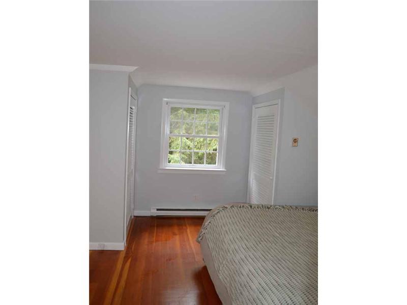 34 Meeker Court Rowayton, CT 06853 - Photo 15 of 22 a bedroom with a bed and a window