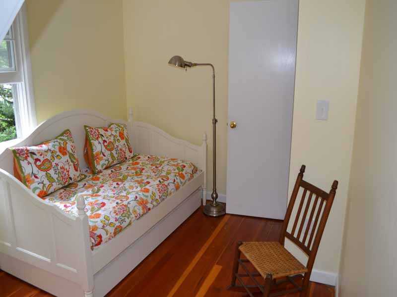 34 Meeker Court Rowayton, CT 06853 - Photo 18 of 22 a bedroom with a bed and wooden floor