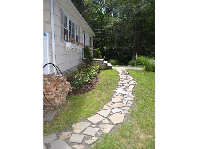 34 Meeker Court Rowayton, CT 06853 - Photo 2 of 22 a front view of a house with a yard