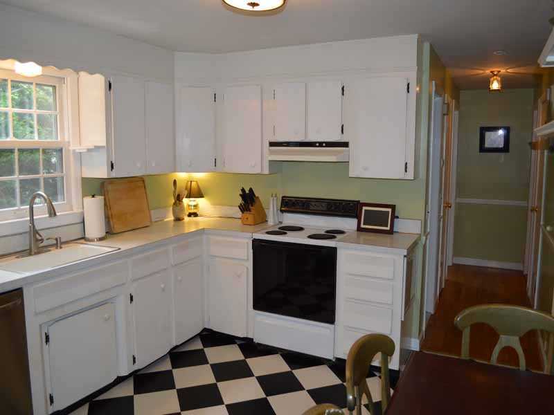 34 Meeker Court Rowayton, CT 06853 - Photo 9 of 22 a kitchen with a sink stove and cabinets