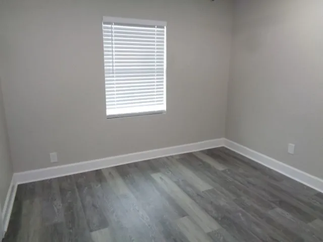 a bath tub sitting next to a white sink