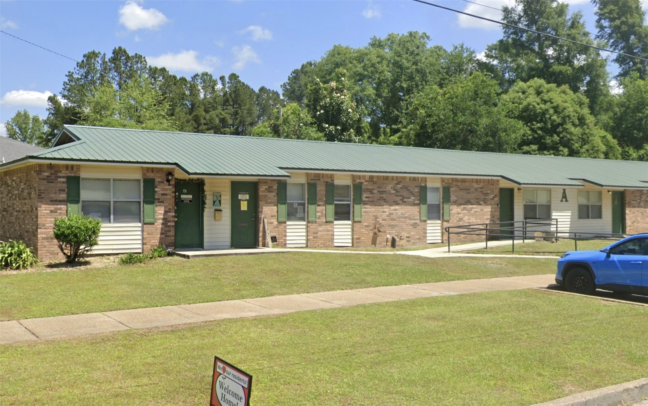 23330 College Avenue Other, AL 36567 - Photo 2 of 7 a view of a house with a yard and sitting area