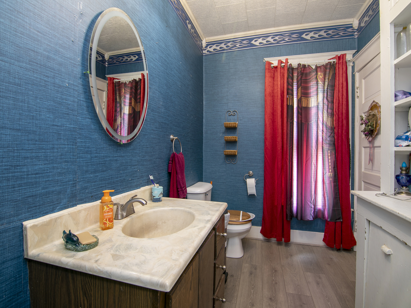 971 North Cleveland Avenue Kankakee, IL 60901 - Photo 11 of 19 a bathroom with a sink and a mirror