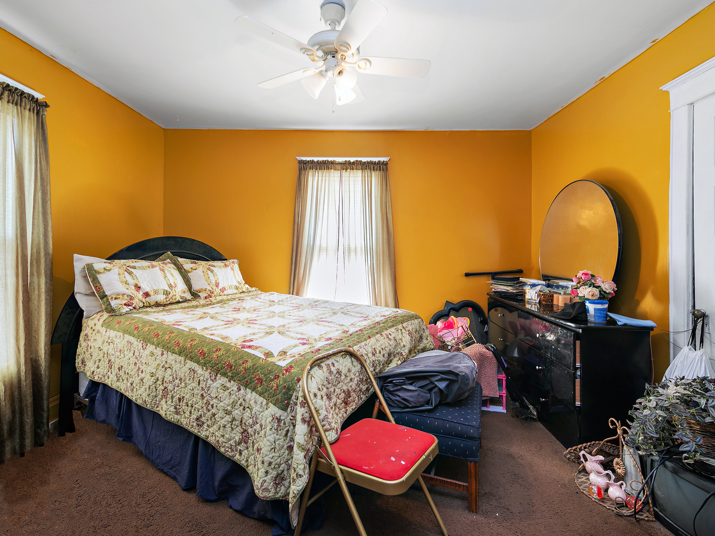 971 North Cleveland Avenue Kankakee, IL 60901 - Photo 12 of 19 a bedroom with a bed and a chandelier