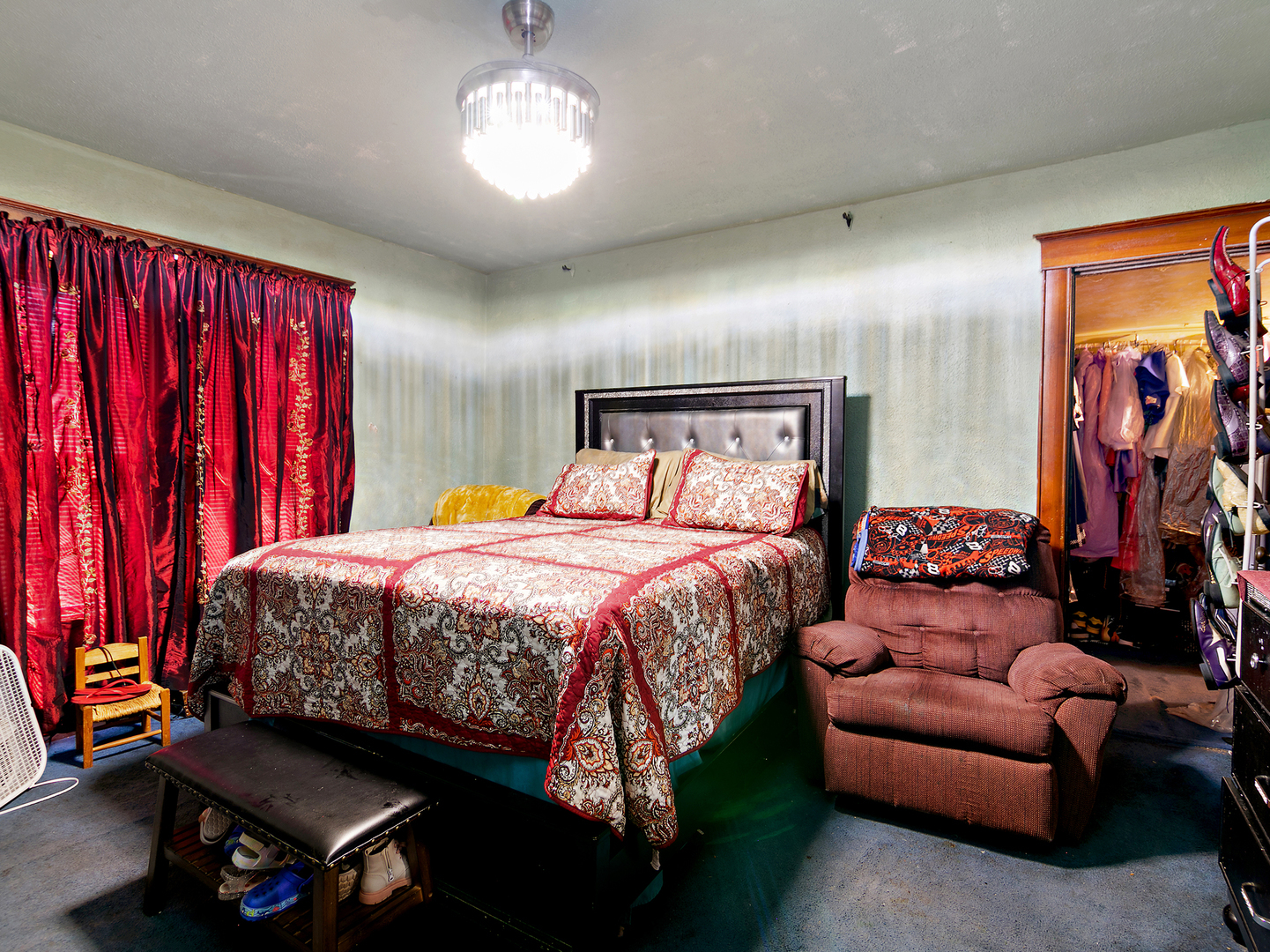 971 North Cleveland Avenue Kankakee, IL 60901 - Photo 13 of 19 a bedroom with a bed and a chandelier