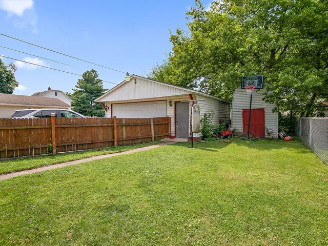 a view of a backyard with a garden and plants