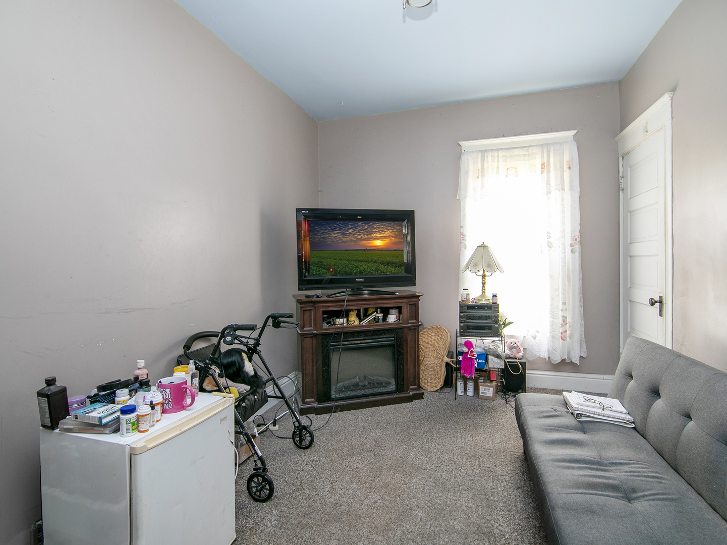971 North Cleveland Avenue Kankakee, IL 60901 - Photo 6 of 19 a living room with furniture and a flat screen tv