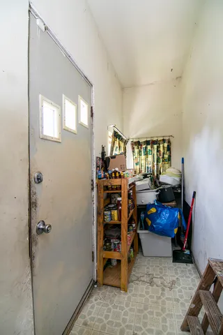a living room with furniture and a book shelf