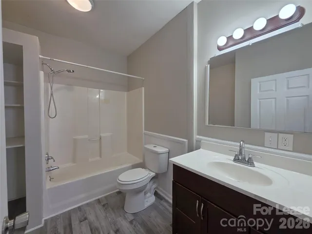 a bathroom with a sink toilet tub and shower